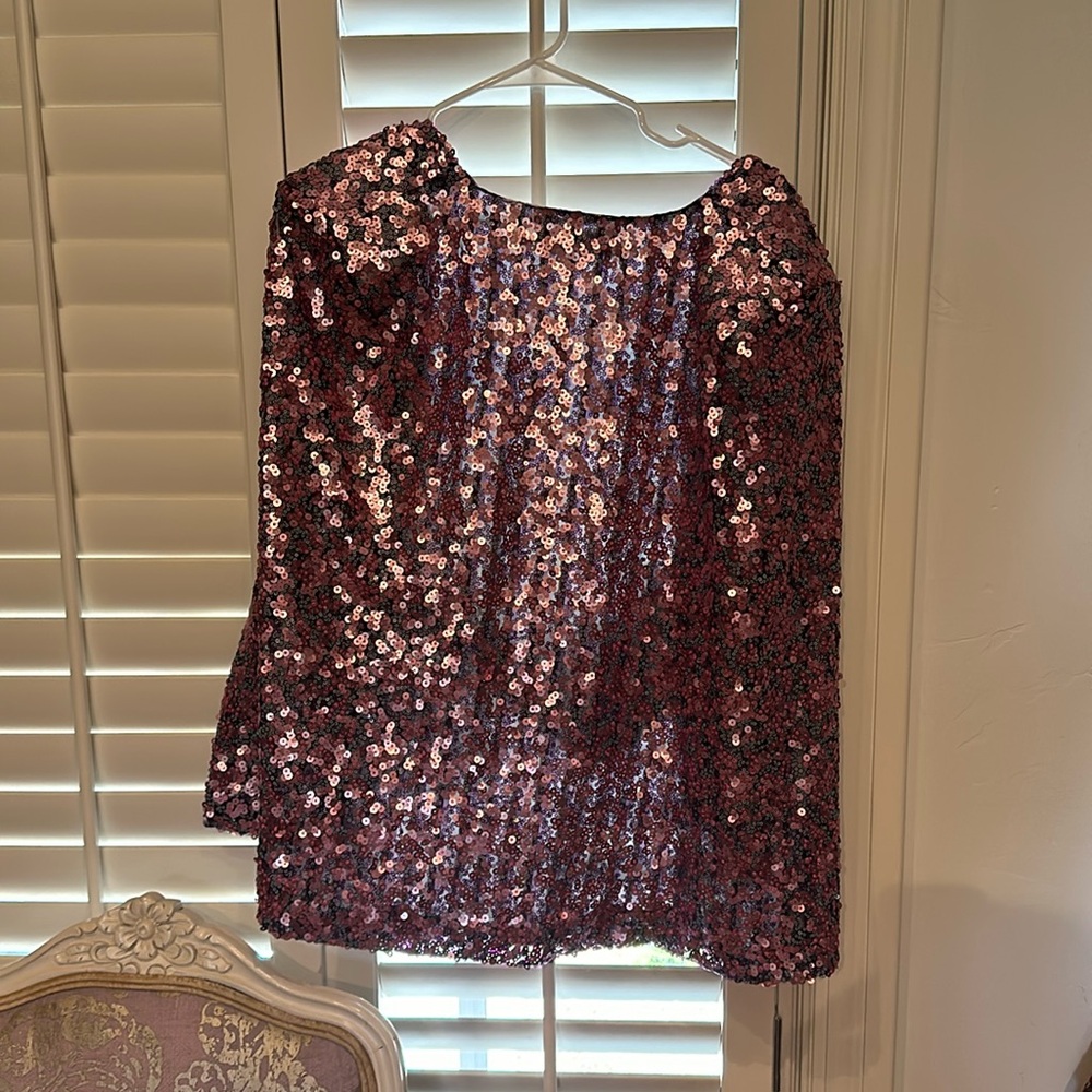Buru sequence cape with arm holes